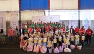 QRCS officials with beneficiaries.
