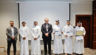  Officials with the participants in a group photograph at the end of the training.