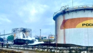 A handout photograph released by the Mayor of Sochi Andrey Proshunin in his Telegram channel on August 3, 2025, shows firefighters working at a fuel depot outside Sochi, after an overnight Ukrainian drone attack. (Photo by Handout / Telegram / t.me/agproshunin / AFP)