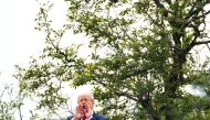 President Donald Trump shouts to reporters from the roof of the White House. (Photo by Demetrius Freeman/The Washington Post)