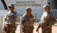 (FILES) Security forces stand guard during a demonstration called by the National Student Union (UNE) against the US government trade taxes and sanctions on Brazil, in front of the US embassy in Brasilia on August 1, 2025. (Photo by SERGIO LIMA / AFP)
