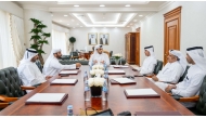 Ministry of Justice officials with some of the newly licensed real estate brokers.