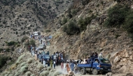 Afghans commute along a hillside, in the aftermath of an earthquake at the Nurgal district of Kunar province on September 3, 2025. (Photo by AFP)