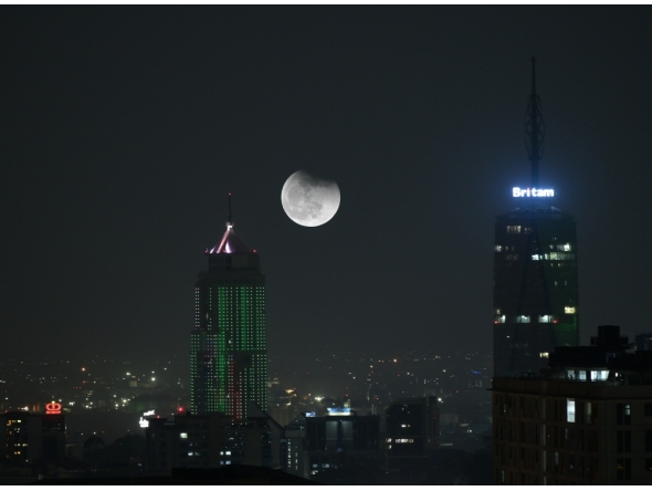 This double-exposure photo shows a view of lunar eclipse in the sky over Nairobi, Kenya, on September 7, 2025 . (Xinhua/Yang Guang)