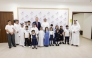 Officials with children during the opening ceremony.