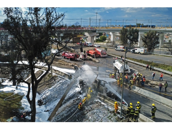 Mexican firefighters extinguish the flames of a gas truck that exploded in Mexico City on September 10, 2025. (Photo by Valentina Alpide / AFP)