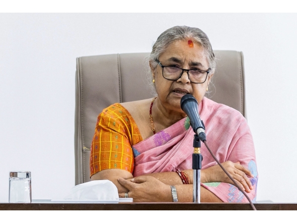 Newly-elected Prime Minister of Nepal's interim government Sushila Karki speaks with officials at the prime minister's office in Kathmandu on September 14, 2025. (Photo by Prabin Ranabhat / AFP)