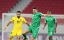 Al Ahli's Julian Draxler (centre) and Al Khaldiya's Komail Al-Aswad fight for the ball.
