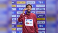 Qatar's Abderrahman Samba poses with his bronze medal.