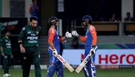 India's Abhishek Sharma and Tilak Varma bump fists during the Asia Cup 2025 Super Four Twenty20 international cricket match between India and Pakistan at the Dubai International Stadium in Dubai on September 21, 2025. (Photo by Fadel SENNA / AFP)
