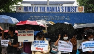 Youth groups stage a protest in front of the Manila Police District Headquarters to demand the release of arrested individuals a day after an anti-corruption rally in Manila on September 22, 2025. (Photo by Jam Sta Rosa / AFP)
 