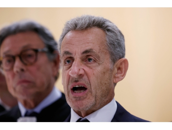 Former French president Nicolas Sarkozy reacts after the verdict in his trial for illegal campaign financing from Libya for his successful 2007 presidential bid, at the Tribunal de Paris courthouse in Paris, on September 25, 2025. (Photo by Alain Jocard / AFP)
