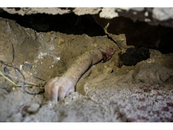Graphic content: The body of child lies buried under the rubble of a building hit by an Israeli strike in the Nuseirat refugee camp in the central Gaza Strip, on September 25, 2025, as Israel presses its air and ground offensive to capture the nearby Gaza City. (Photo by Eyad BABA / AFP)
