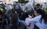 Members of the security forces detain a protester as others scuffle during a youth-led demonstration in Rabat on September 29, 2025, calling for reforms in the public health and education sectors. Dozens of youths were detained on September 29 in Morocco on the third day of protests calling for education and public health reforms, according to a local rights group and AFP reporters. (Photo by Abdel Majid Bziouat / AFP)
