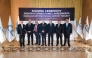 Officials pose for a group photo during the signing of agreement.