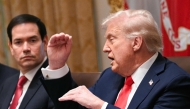 US President Donald Trump speaks, as Secretary of State Marco Rubio looks on, during a cabinet meeting in the Cabinet Room of the White House in Washington, DC, on October 9, 2025. (Photo by Jim Watson / AFP)