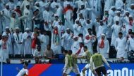 UAE's defender #16 Marcus Meloni (L) celebrates after scoring his team's first goal during the FIFA World Cup 2026 Asian qualifier football match between United Arab Emirates and Oman at Jassim Bin Hamad Stadium in Doha on October 11, 2025. (Photo by Karim JAAFAR / AFP)