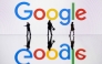 This illustration photograph taken on October 30, 2023, in Mulhouse, eastern France, shows figurines next to a screen displaying a logo of Google, a US multinational technology company. Photo by SEBASTIEN BOZON / AFP