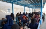Afghan women and children refugees deported from Pakistan wait inside a registration centre upon their arrival at the zero point border crossing between Afghanistan and Pakistan in the Spin Boldak district of Kandahar province on October 19, 2025. (Photo by Sanaullah Seiam / AFP)
