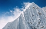 In this handout photograph taken on October 15, 2025, a French mountaineer makes his way near the summit of Jannu East, the first ascent of the 7,468 m peak in eastern Nepal. (Photo by Thibaut Marot / AFP)
