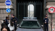French police officers stand in front of the Louvre Museum after a robbery, in Paris on October 19, 2025. (Photo by Dimitar Dilkoff / AFP)