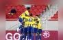 Al Gharafa players celebrate after scoring a goal.