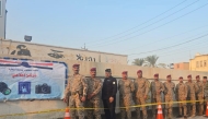 Security personnel waiting in line to vote in Iraq