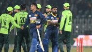 Sri Lanka's Maheesh Theekshana (CL) and Sri Lanka's Asitha Fernando (CR) shake hands with Pakistan's players at the end of the first one-day international (ODI) cricket match between Pakistan and Sri Lanka at the Rawalpindi Cricket Stadium in Rawalpindi on November 11, 2025. (Photo by Aamir QURESHI / AFP)