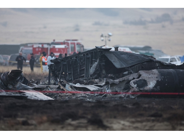 Wreckage is seen at the crash site of the Turkish C-130 military cargo plane in the Sighnaghi area at the Georgia-Azerbaijan border on November 12, 2025. Photo by Giorgi ARJEVANIDZE / AFP