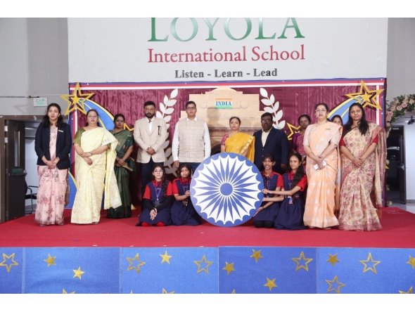 School principal and guests with the winning students and teachers.  