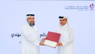 Undersecretary of the Ministry of Awqaf and Islamic Affairs H E Dr. Sheikh Khalid bin Mohammed bin Ghanem Al Thani honouring CEO of Seashore Group Salem Saeed Al Mohannadi.