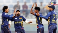 Sri Lanka captain Dunith Wellalage (left) celebrates with teammates.