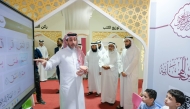 Minister of Awqaf and Islamic Affairs H E Ghanem bin Shaheen Al Ghanem with other officials touring an associated exhibition of the 30th edition of the Sheikh Jassim bin Mohammed bin Thani Quran Competition at Imam Muhammad bin Abd Al-Wahhab Mosque. 