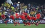 Portugal players celebrate after winning the penalty shoot out against Brazil.