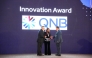 A QNB official receiving the award at Red Hat Summit 2025.
