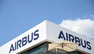 (FILES) The logo of Aerospace company Airbus is displayed at the Pavillon Airbus during the 55th edition of the International Paris Air Show at the Paris Bourget Airport, in Le Bourget, suburb of Paris on June 17, 2025. (Photo by Bertrand GUAY / AFP)