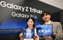 Promoters show Samsung Galaxy Z TriFold smartphones during a launch event at a Samsung store in Seoul on December 2, 2025. (Photo by Jung Yeon-je / AFP)