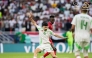 Algeria's Redouane Berkane (foreground) controls the ball.