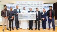LuLu Hypermarket Qatar and Qatar Cancer Society officials during the cheque handover ceremony.
