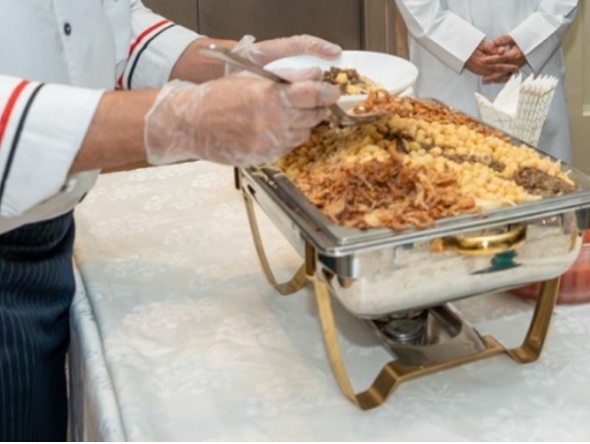 File photo for a chef serving koshary.