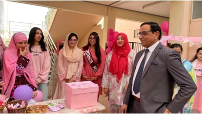 PISQ Principal Ch Muhammad Afzal along with staff and students during the event. 