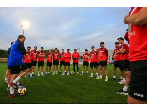 Iraq players assemble ahead of their training session. 