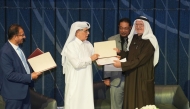 Minister of State and President of Qatar National Library H E Dr. Hamad bin Abdulaziz Al Kawari with other officials and guests during the event.
