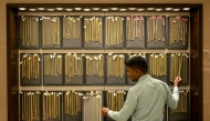 (Files) A salesman arranges gold chains at a jewellery store on July 5, 2025. (Photo by R. Satish Babu / AFP)