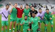 Al Ahli players celebrate their win.