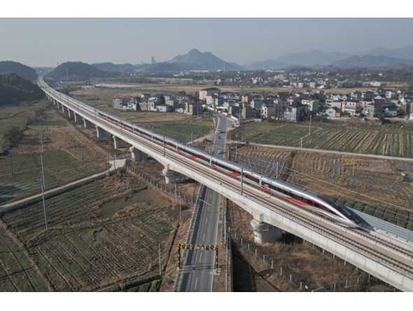 An aerial drone photo taken on Dec. 26, 2025 shows the C3132 passenger train bound for Hangzhou running along the Hangzhou-Quzhou high-speed railway in east China's Zhejiang Province. (Xinhua/Huang Zongzhi)
 