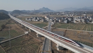 An aerial drone photo taken on Dec. 26, 2025 shows the C3132 passenger train bound for Hangzhou running along the Hangzhou-Quzhou high-speed railway in east China's Zhejiang Province. (Xinhua/Huang Zongzhi)
 