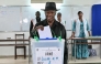 Ivory Coast's President Alassane Ouattara casts his ballot at a polling station at the Lycee Saint-Marie in Cocody, Abidjan, on December 27, 2025 during Ivory Coast's legislative elections. (Photo by SIA KAMBOU / AFP)