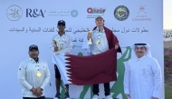 Qatar players celebrate on the podium after winning the U-16 team and individual titles at the Gulf Golf Championship in Oman.