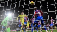 Tottenham's  Archie Gray (centre) heads in the opening goal against Crystal Palace. 